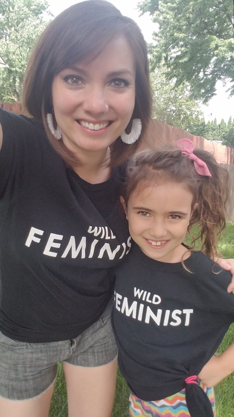 Nikole Mitchell and her daughter wearing "Wild Feminist" shirts